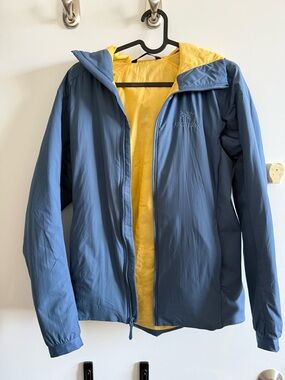 Arc'teryx blue shell jacket with yellow interior